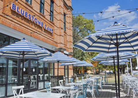 Golden Road pop-up event featuring custom tri-color branded umbrellas creating a vibrant outdoor act