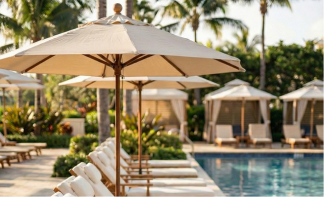 Custom branded Umbrella Source cabana at a luxury resort poolside creating a shaded lounge area
