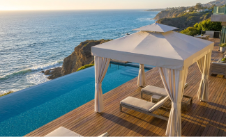 Frankford white Marbella cabana on oceanfront deck with luxury outdoor shade structure overlooking t