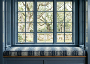Color-drenched room with vibrant blue custom window seat cushion